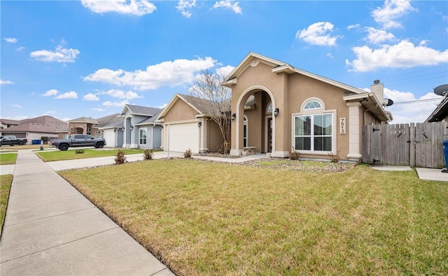 ranch-style house with a garage and a front yard