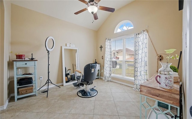 misc room with light tile patterned flooring, high vaulted ceiling, and ceiling fan