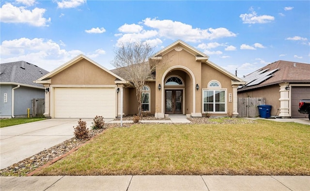 view of front facade featuring a garage and a front yard