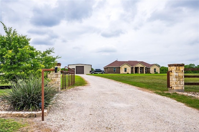 view of street with driveway and a gated entry