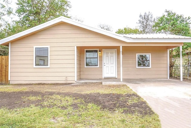 view of front of home with a carport