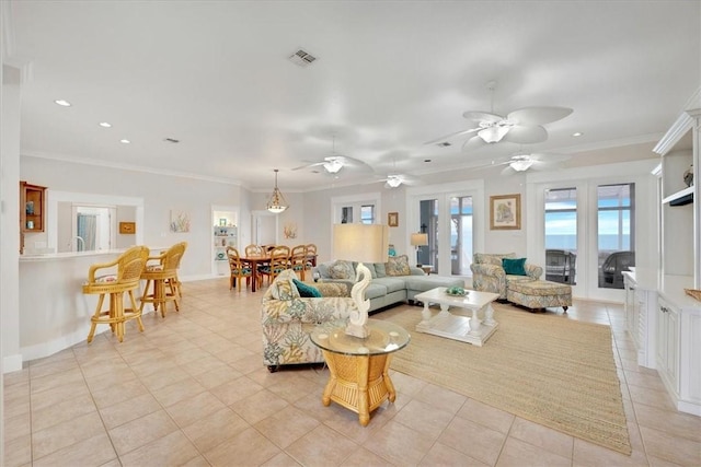 living room featuring french doors, ornamental molding, and light tile patterned floors