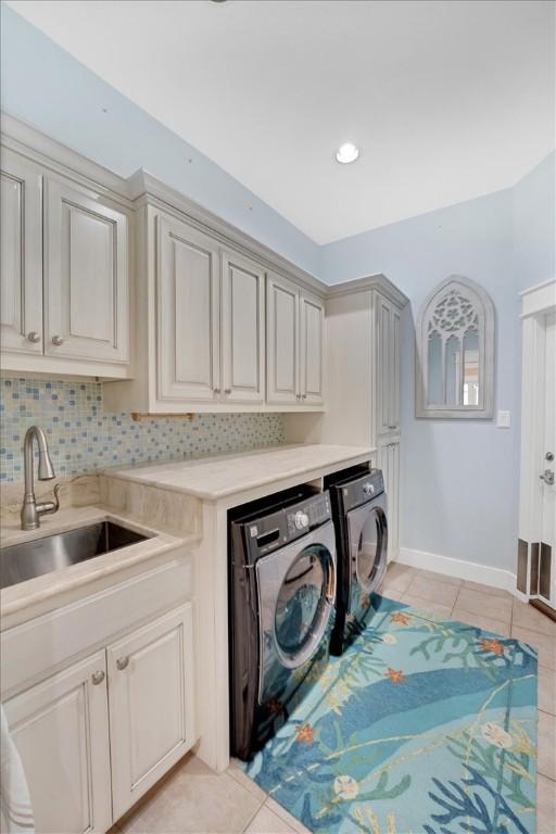 bedroom featuring a spacious closet, a closet, light tile patterned floors, crown molding, and ceiling fan