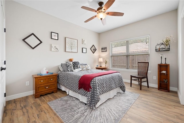 116 James Dr, Sinton, TX 78387 - bedroom with light wood-style floors, baseboards, and ceiling fan