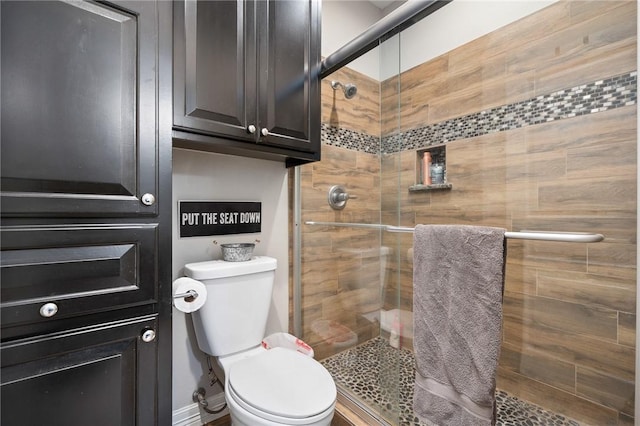 116 James Dr, Sinton, TX 78387 - bathroom featuring a shower stall and toilet