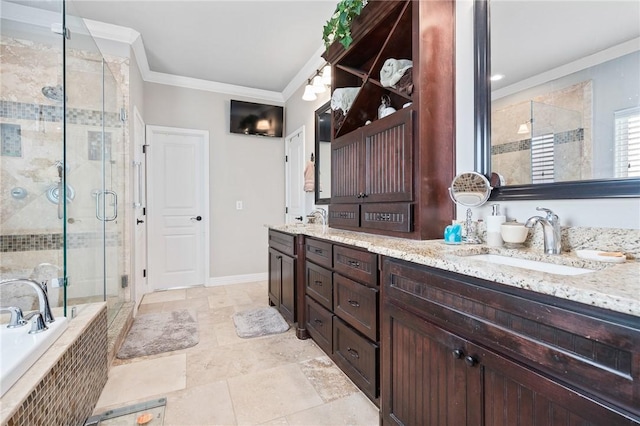 116 James Dr, Sinton, TX 78387 - bathroom featuring ornamental molding, a shower stall, double vanity, tiled bath, and baseboards