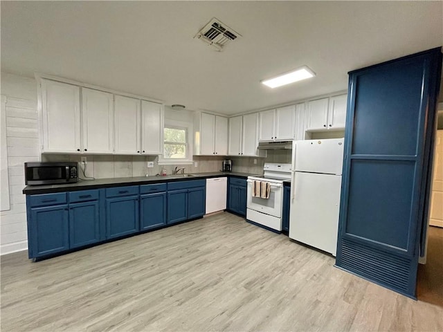 kitchen with white appliances, blue cabinets, sink, light wood-type flooring, and white cabinetry