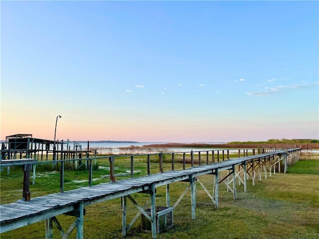 dock area with a water view and a rural view