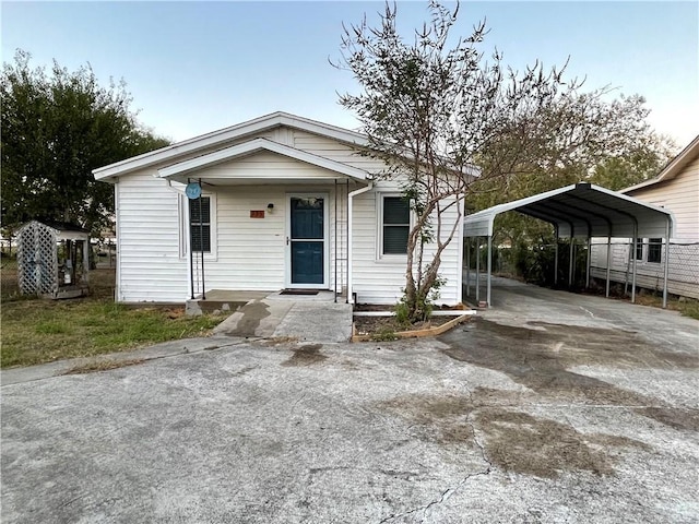 view of front facade with a carport