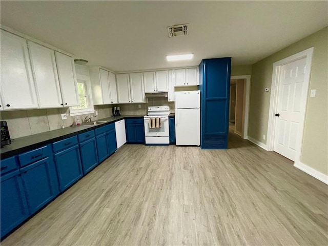 kitchen with white appliances, sink, blue cabinetry, white cabinets, and light hardwood / wood-style floors