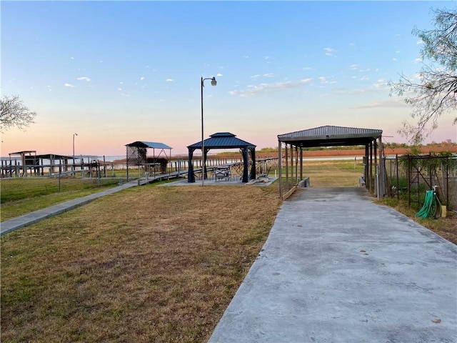 exterior space with a gazebo and a lawn