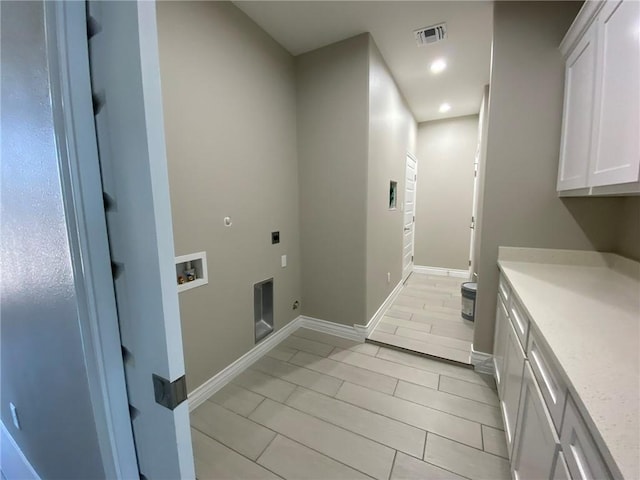13941 Flintlock Dr, Corpus Christi, TX 78418 - laundry room featuring cabinet space, hookup for an electric dryer, washer hookup, recessed lighting, and hookup for a gas dryer