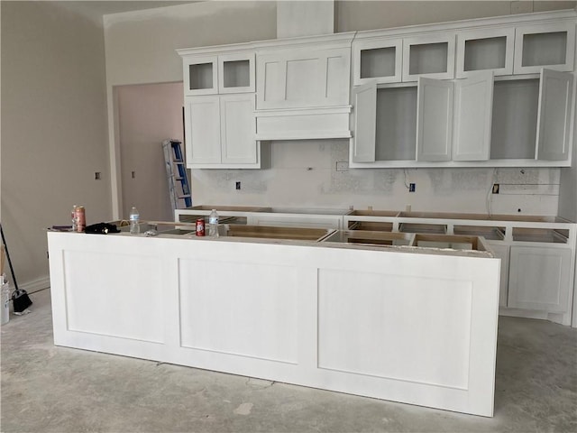 kitchen with white cabinetry and a kitchen island