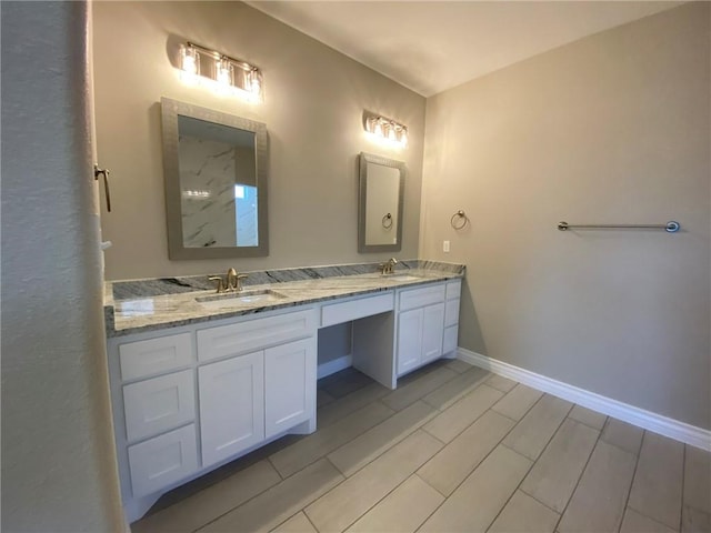 13941 Flintlock Dr, Corpus Christi, TX 78418 - bathroom with double vanity and baseboards