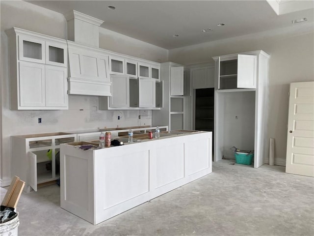 kitchen with white cabinets and tasteful backsplash