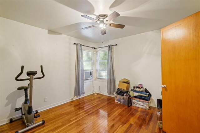 bedroom with hardwood / wood-style flooring and ceiling fan