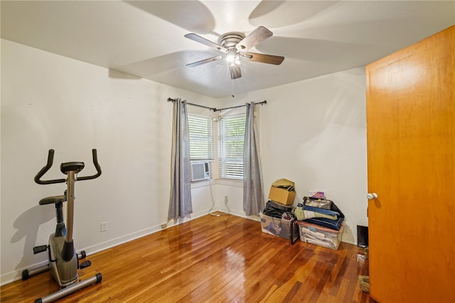 workout area with hardwood / wood-style floors and ceiling fan