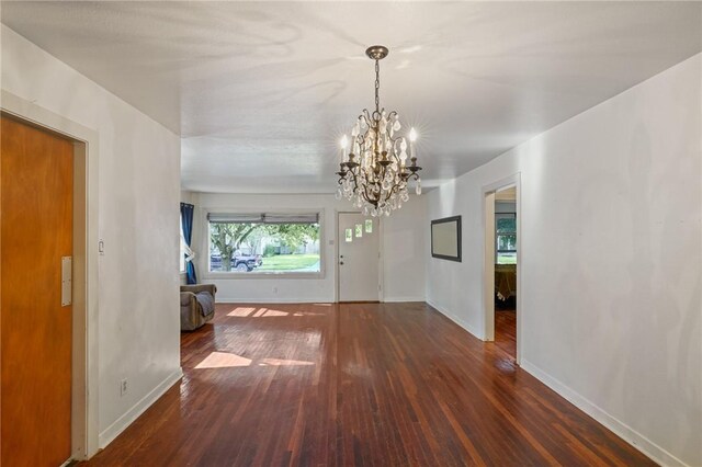 unfurnished room featuring dark hardwood / wood-style floors and cooling unit