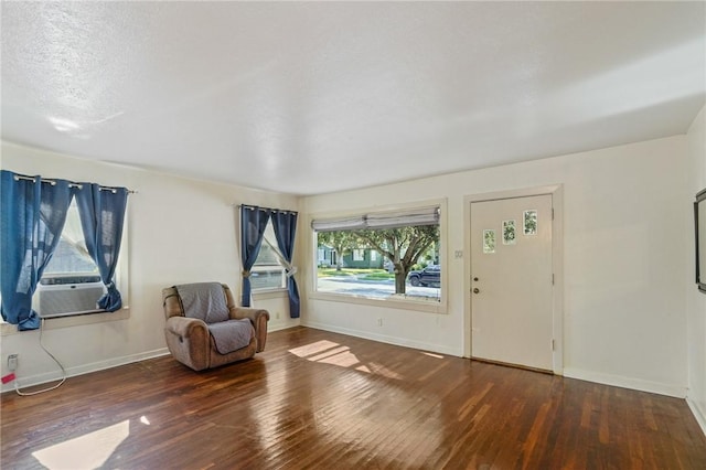 interior space featuring a notable chandelier and dark wood-type flooring