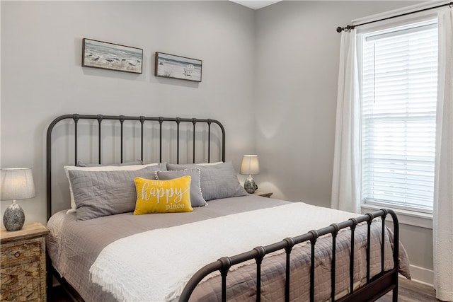 bedroom with wood-type flooring