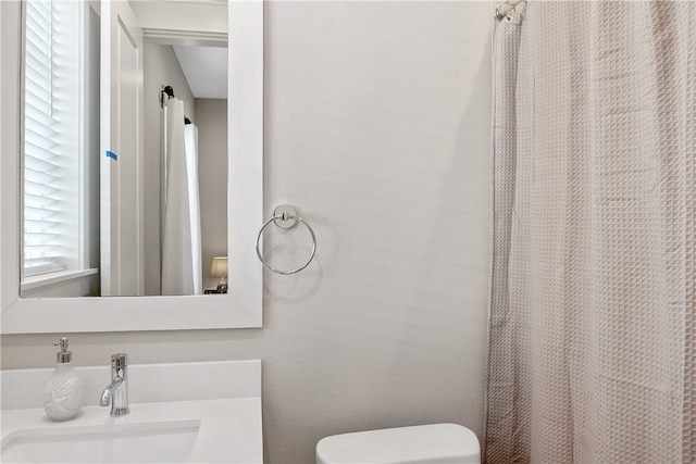 bathroom with sink and toilet