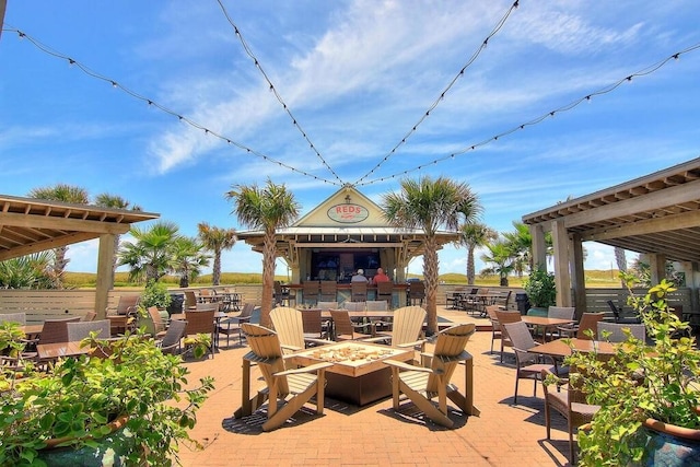 view of patio / terrace featuring a fire pit and a gazebo