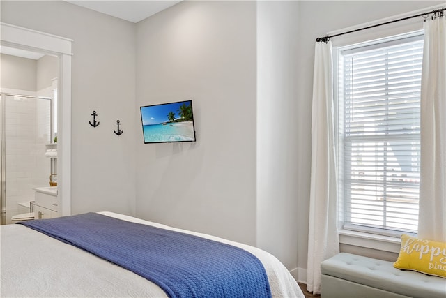 bedroom featuring ensuite bath