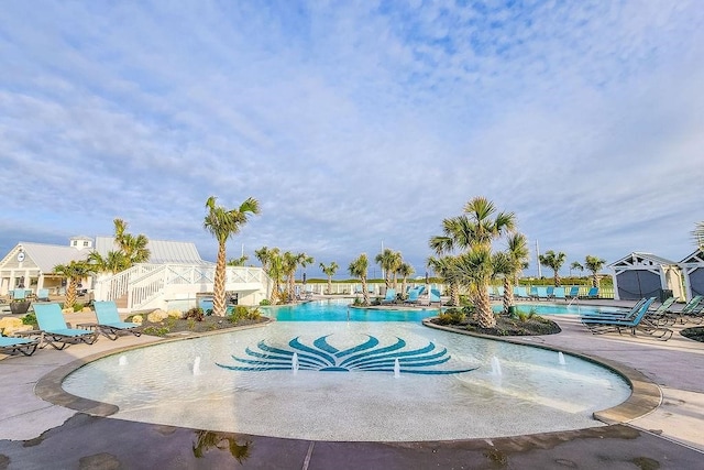 view of swimming pool featuring a patio area and pool water feature