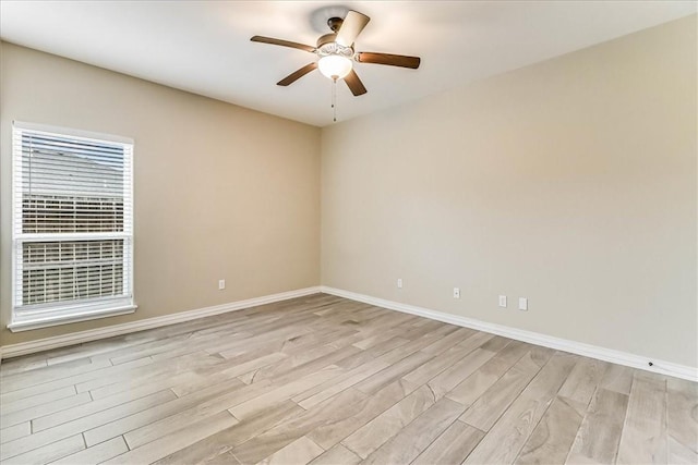 empty room with light hardwood / wood-style floors and ceiling fan