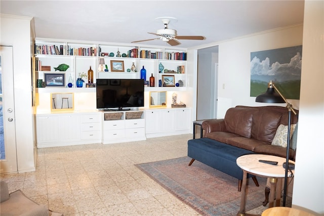 living area featuring light floors, a ceiling fan, and crown molding