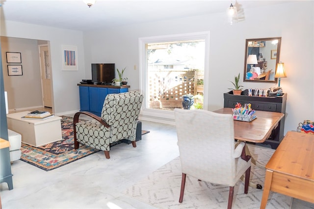 dining area featuring baseboards