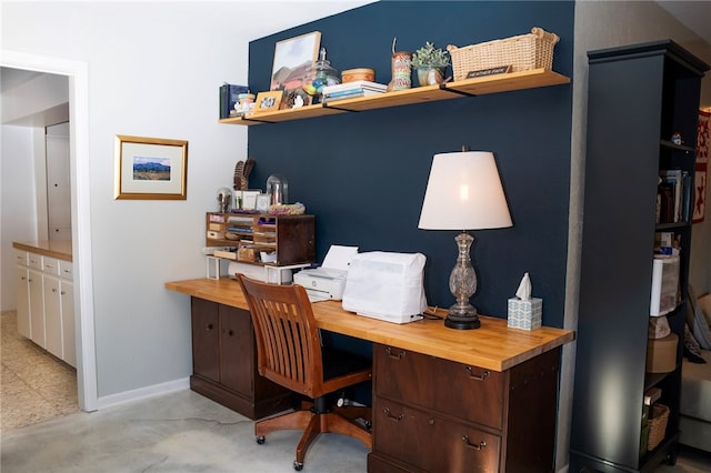 office space with baseboards