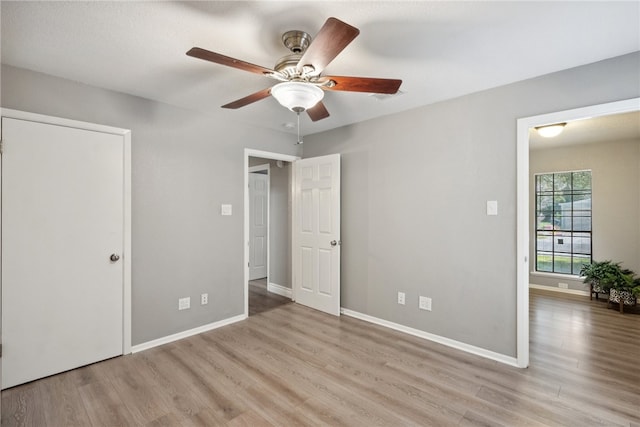 unfurnished bedroom with light wood-type flooring and ceiling fan