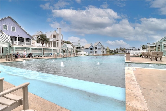 view of pool featuring a residential view