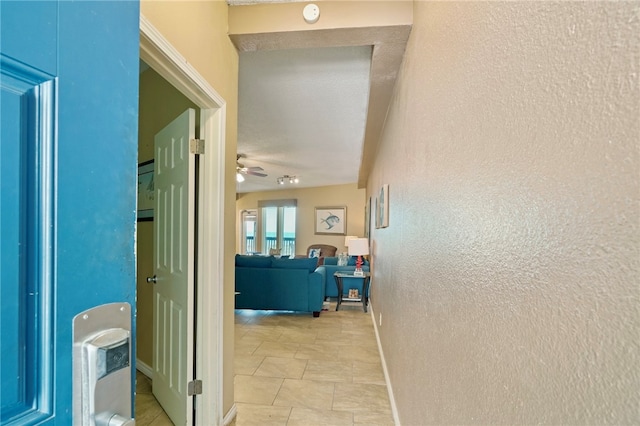 hallway with light tile patterned flooring