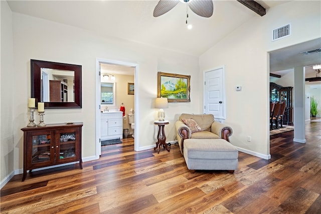 living area featuring vaulted ceiling with beams, dark hardwood / wood-style floors, and ceiling fan