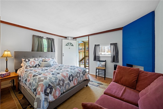 bedroom with hardwood / wood-style floors