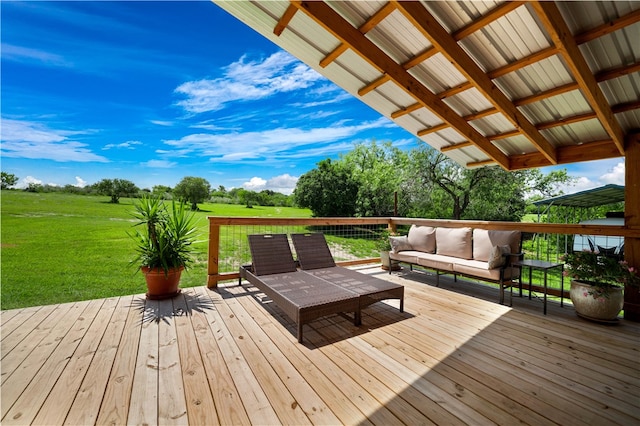 wooden deck with outdoor lounge area and a lawn