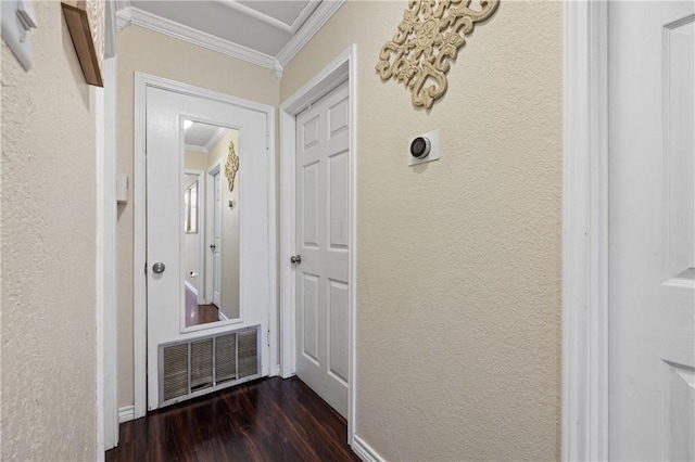 hall featuring crown molding and dark wood-type flooring