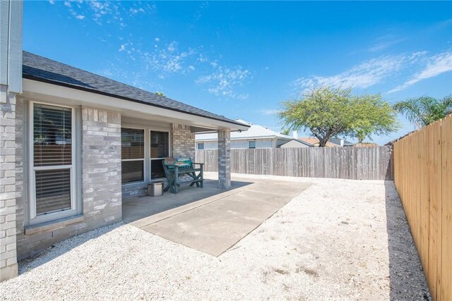 13948 Lighthouse Dr, Corpus Christi, TX 78418 - fenced backyard with a patio area