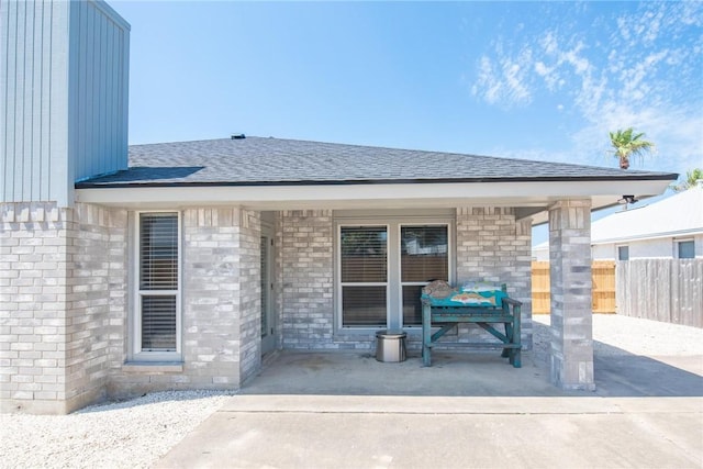 13948 Lighthouse Dr, Corpus Christi, TX 78418 - back of house featuring roof with shingles and brick siding