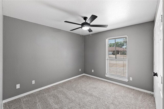 13948 Lighthouse Dr, Corpus Christi, TX 78418 - carpeted spare room with a ceiling fan, baseboards, and a textured ceiling