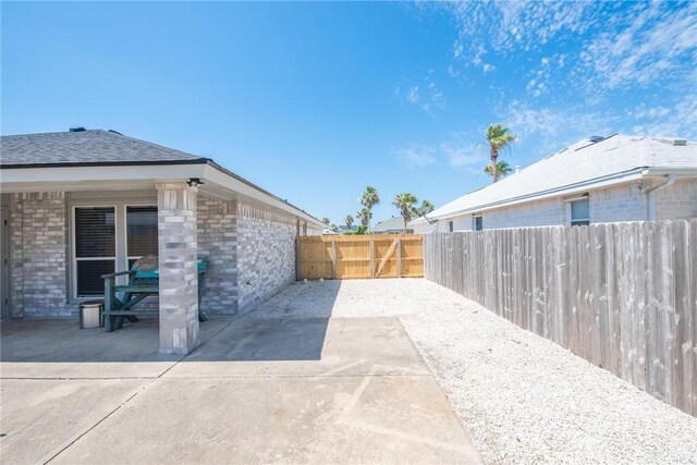 13948 Lighthouse Dr, Corpus Christi, TX 78418 - fenced backyard with a patio area