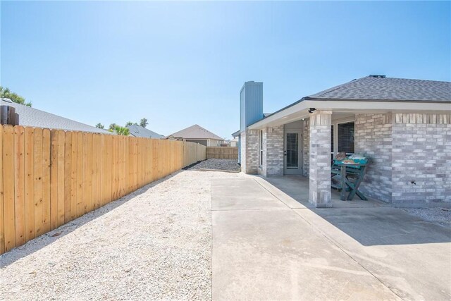13948 Lighthouse Dr, Corpus Christi, TX 78418 - fenced backyard featuring a patio