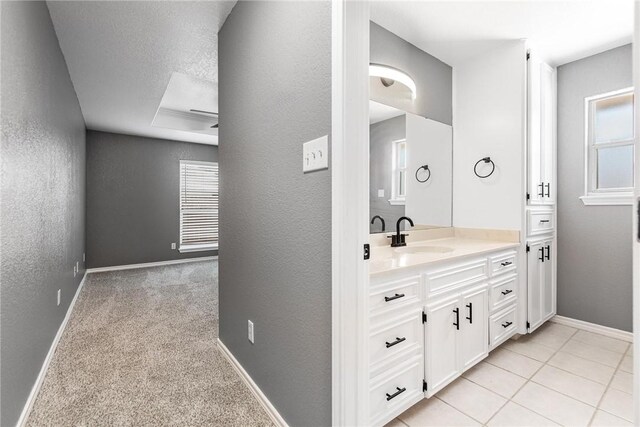 13948 Lighthouse Dr, Corpus Christi, TX 78418 - bathroom featuring vanity, a textured wall, baseboards, and plenty of natural light