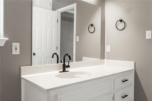 13948 Lighthouse Dr, Corpus Christi, TX 78418 - bathroom with a textured wall and vanity