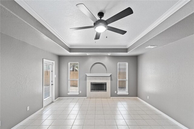 13948 Lighthouse Dr, Corpus Christi, TX 78418 - unfurnished living room with a raised ceiling, crown molding, a fireplace, a textured ceiling, and ceiling fan
