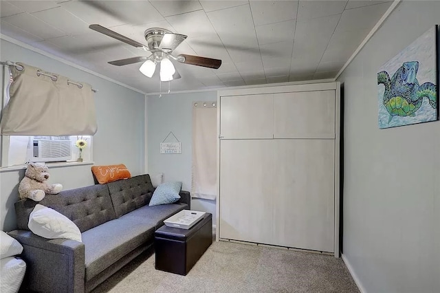 living room featuring light carpet, cooling unit, ornamental molding, and ceiling fan