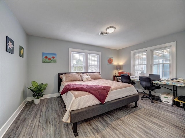 bedroom with wood-type flooring