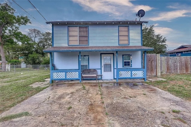 view of front of home with a front lawn and covered porch